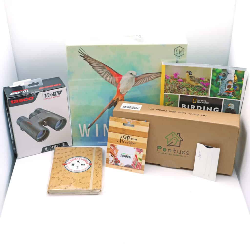 Bird-related items including books, a journal, binoculars, and gift cards